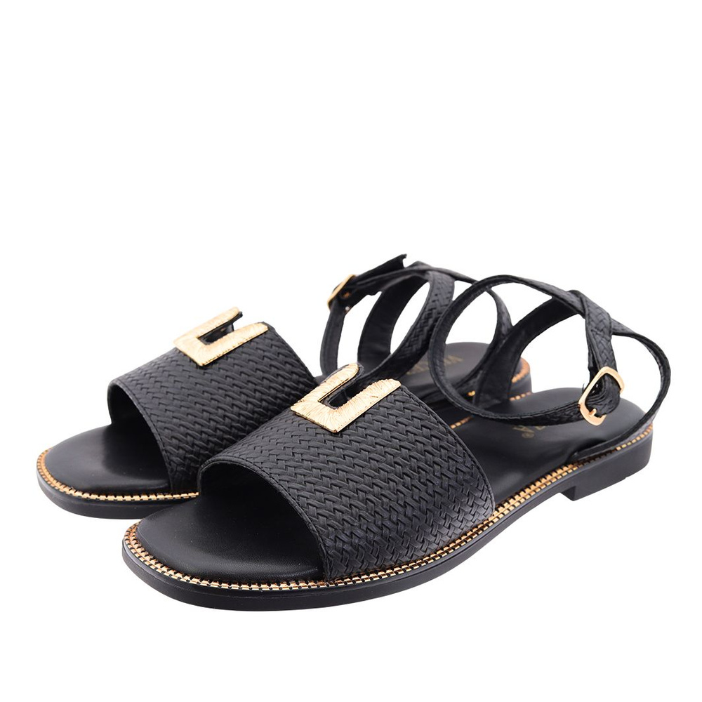 Чорні босоніжки на плоскій підошві з пряжкою Vinceza