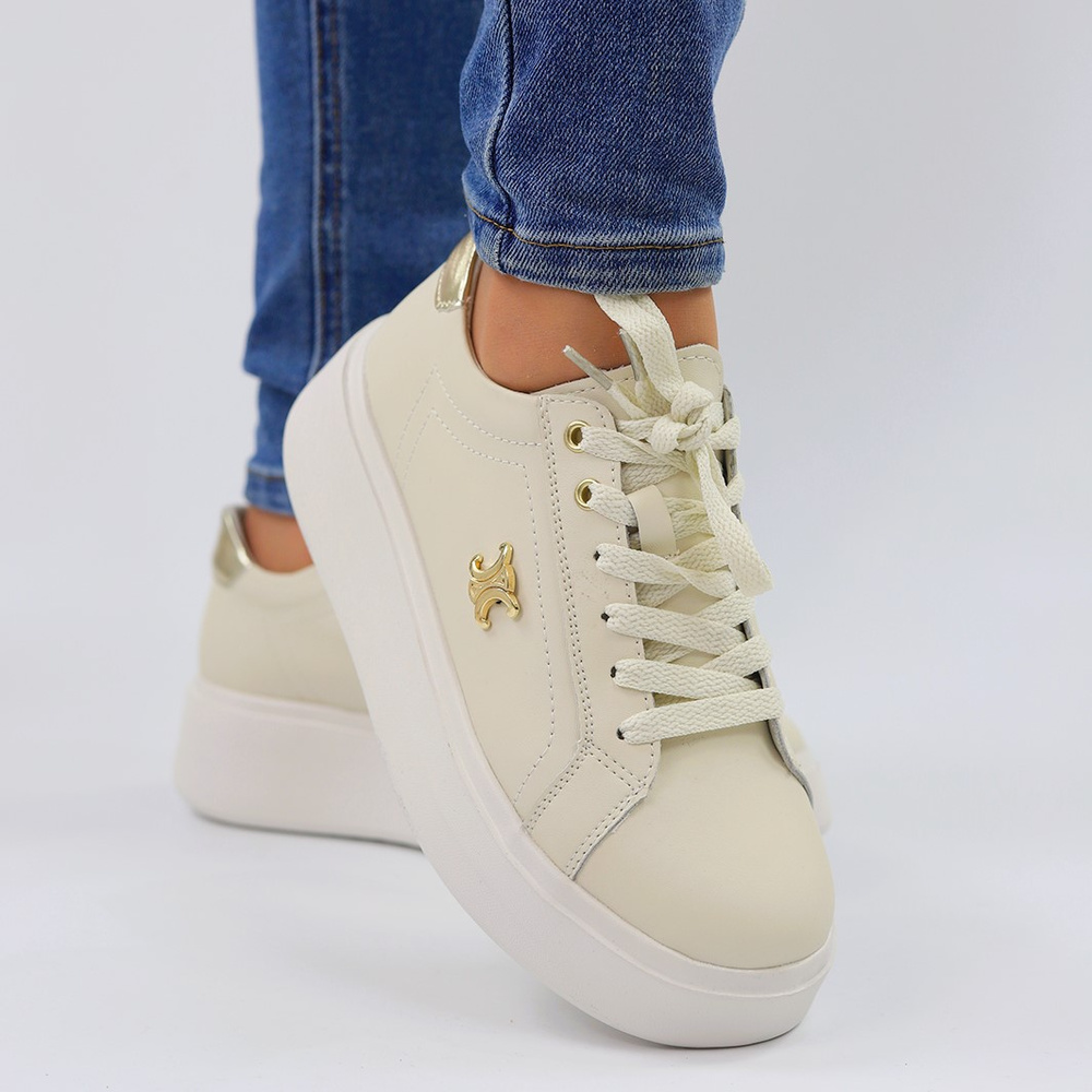 Бежеві шкіряні кросівки з золотими вставками на платформі Potocki