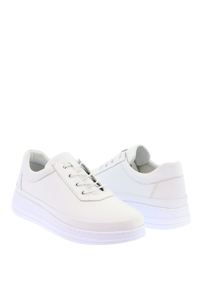 Білі жіночі шкіряні спортивні туфлі на платформі