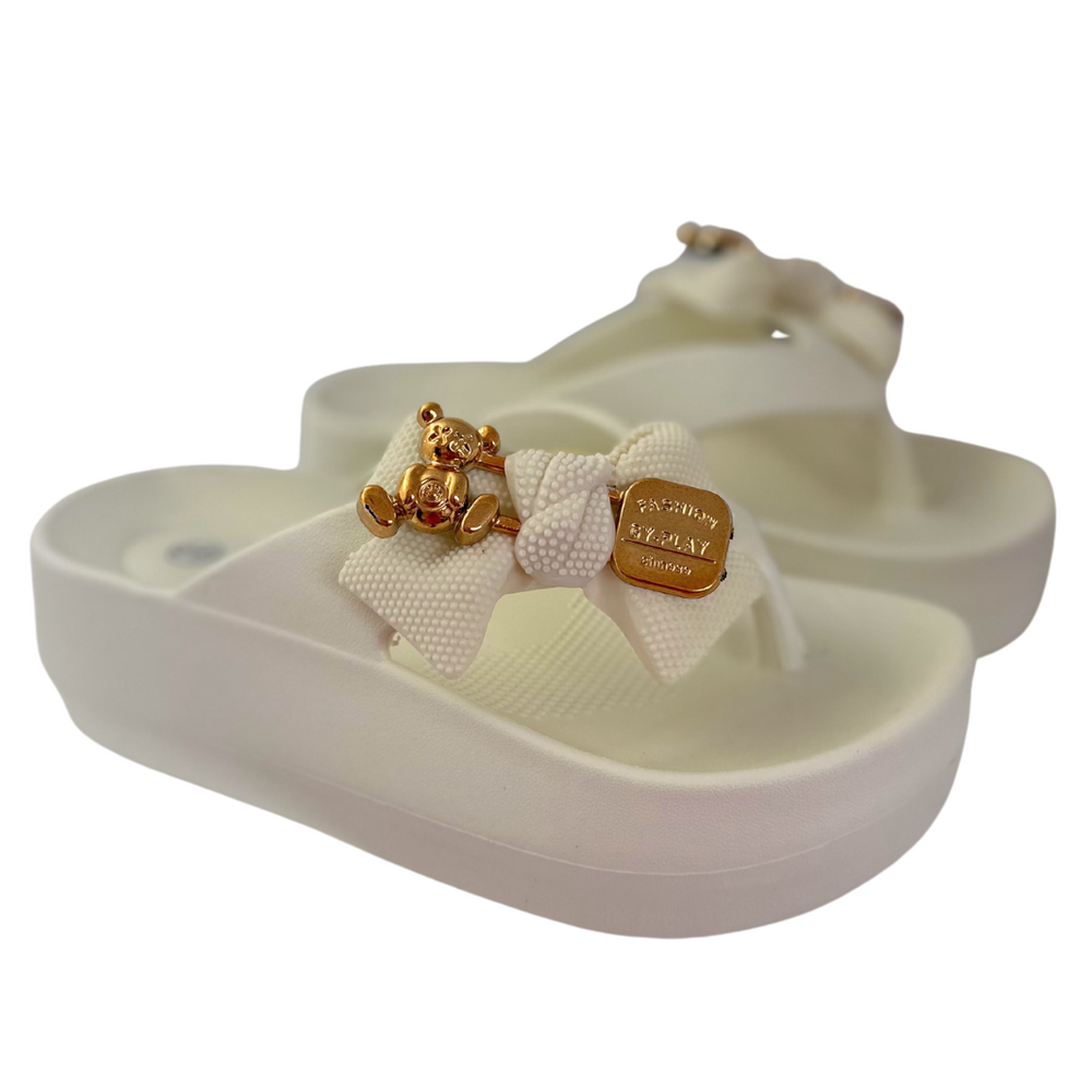 Білі шльопанці з золотими аплікаціями 