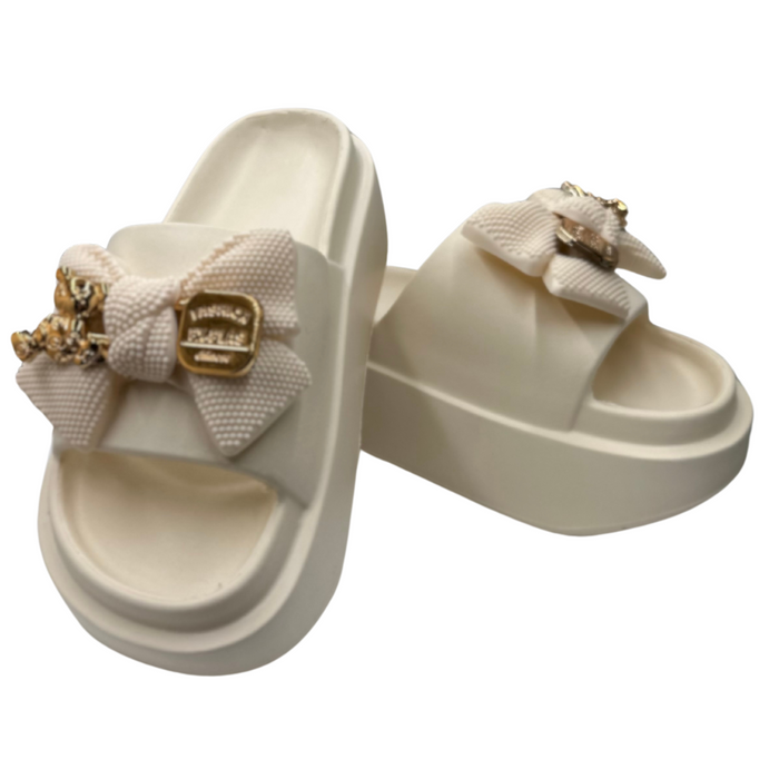 Бежеві гумові шльопанці на платформі