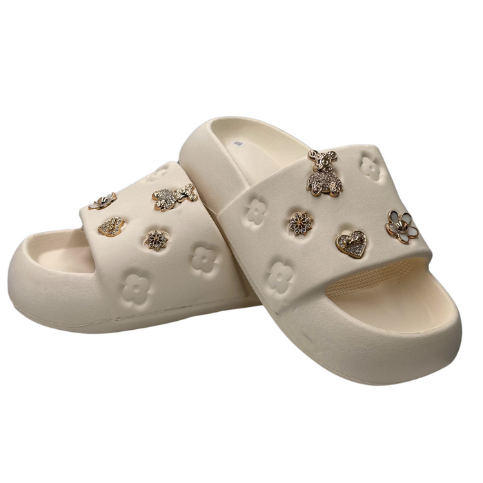 Бежеві поролонові тапочки з аплікаціями