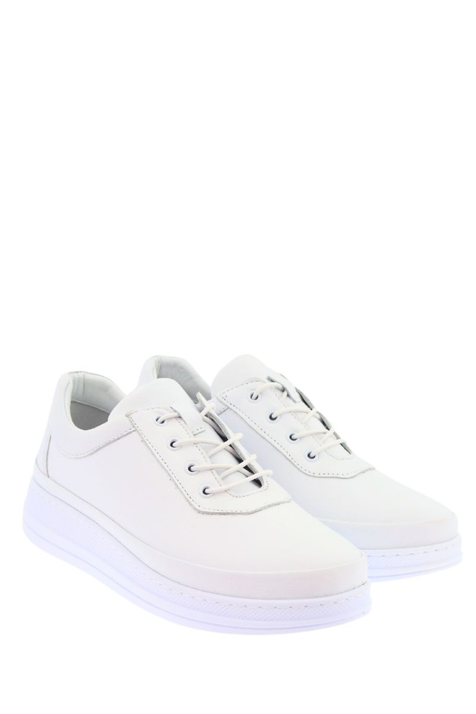 Білі жіночі шкіряні спортивні туфлі на платформі